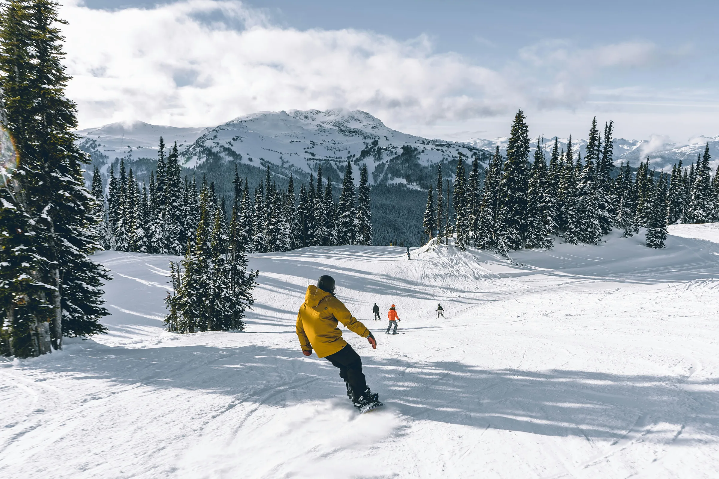 Snow-covered peaks rising above Whistler Village in the Coast Mountains